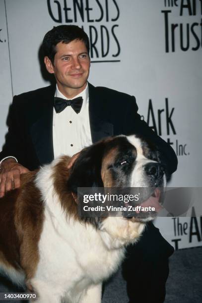 American actor Thomas Calabro, one of the awards show's presenters, with 'Beethoven,' a St Bernard dog, in the press room of the Ark Trust's 11th...