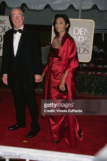 British actor Michael Caine and his wife, Guyanese actress and fashion model Shakira Caine attend the 56th Annual Golden Globe Awards, held at the...