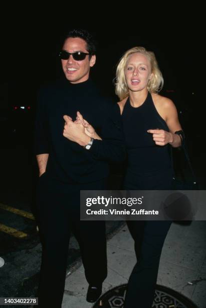 American actor Dean Cain and American singer Mindy McCready attend the Hollywood premiere of 'Men in Black,' held at the Cinerama Dome Theater in Los...