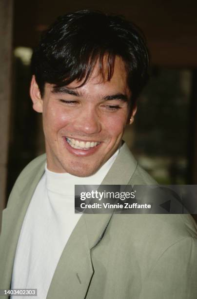 American actor Dean Cain, wearing a pale green blazer over a white t-shirt, attends the Century City premiere of 'Home Alone 2: Lost in New York,'...