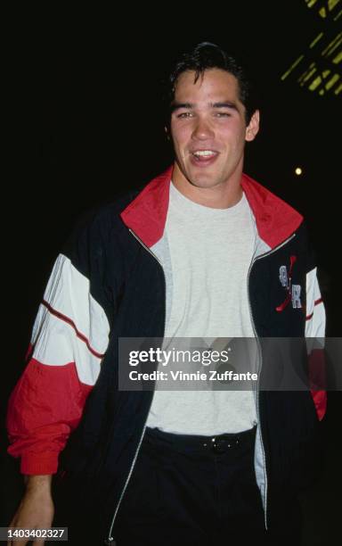 American actor Dean Cain, wearing a black, red and white Air Jordan jacket, United States, 1993.