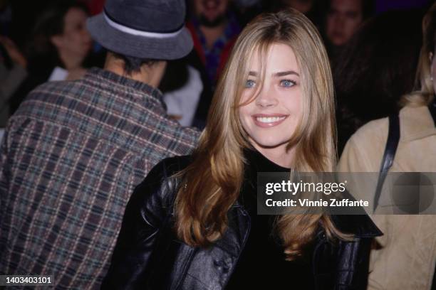 American actress Denise Richards attends the Hollywood premiere of 'Scream 2,' held at Mann's Chinese Theatre in Los Angeles, California, 10th...