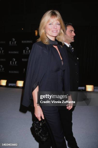 America fashion model Cheryl Tiegs, accompanied by a man, attends the Tribute to Style Millennium Exhibition and Concert, held on Rodeo Drive in...