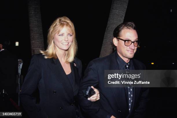 American fashion model Cheryl Tiegs and her husband, American actor Anthony Peck attend the Beverly Hills premiere of 'The Addams Family,' held at...