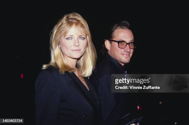 American fashion model Cheryl Tiegs and her husband, American actor Anthony Peck attend the Beverly Hills premiere of 'The Addams Family,' held at...