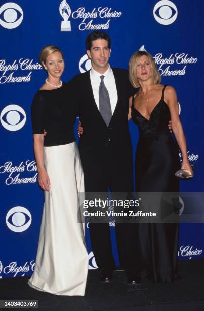 American actress and comedian Lisa Kudrow, American actor and comedian David Schwimmer, and American actress Jennifer Aniston in the press room of...