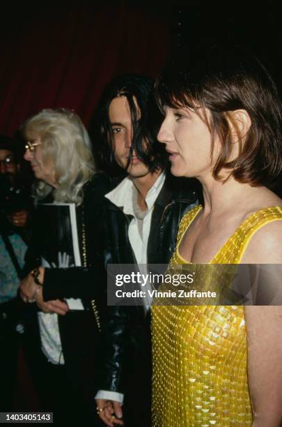 American actors Johnny Depp and Ellen Barkin attend the APLA Fashion Show Honors Isaac Mizrahi at the Mann's Chinese Theater in Los Angeles,...