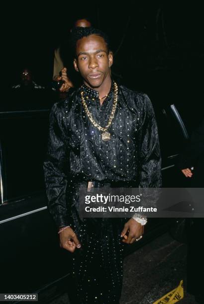 American singer, songwriter and dancer Bobby Brown, wearing a black jumpsuit, attends the 1989 MTV Video Music Awards, held at the Universal...