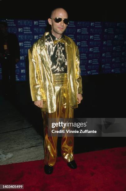 American singer, songwriter and musician Moby, wearing a gold suit with a gold bow tie, attends the 16th Annual MTV Video Music Awards, held at the...
