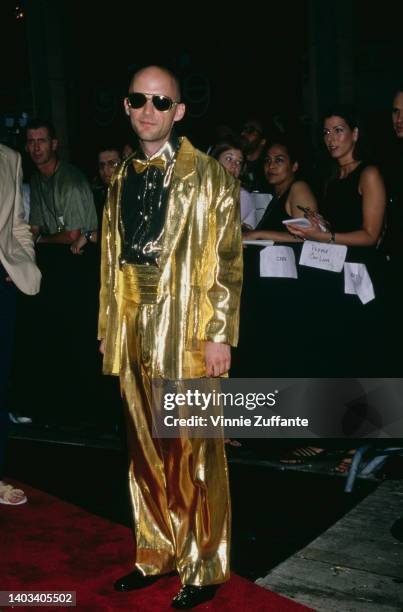 American singer, songwriter and musician Moby, wearing a gold suit with a gold bow tie, attends the 16th Annual MTV Video Music Awards, held at the...