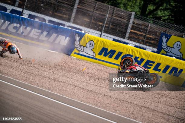 Pol Espargaro of Spain and Repsol Honda Team crashes at turn one during the free practice of the MotoGP Liqui Moly Motorrad Grand Prix Deutschland at...