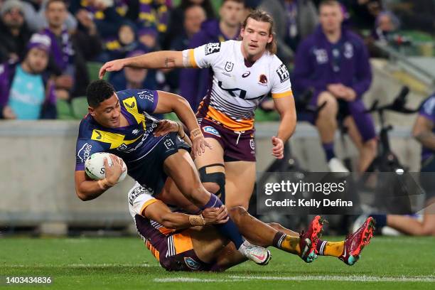 Dean Ieremia of the Storm is tackled during the round 15 NRL match between the Melbourne Storm and the Brisbane Broncos at AAMI Park, on June 17 in...