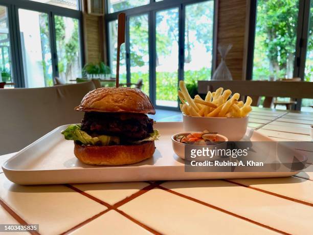 The Wagyu Beef Burger with Monterey Jack, mushrooms, tomato, onion jam and black truffle from the Lido Bar at The Standard Hua Hin hotel that opened...