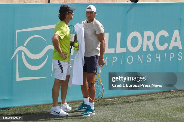 Tennis player Rafael Nadal with his coach Carlos Moya during a training session open to the press, at the Mallorca Country Club, on June 17 in Santa...