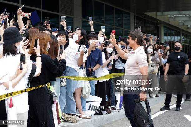 Actor Tom Cruise waves to his fans upon his arrival at Gimpo International Airport on June 17, 2022 in Seoul, South Korea. Tom Cruise is visiting...