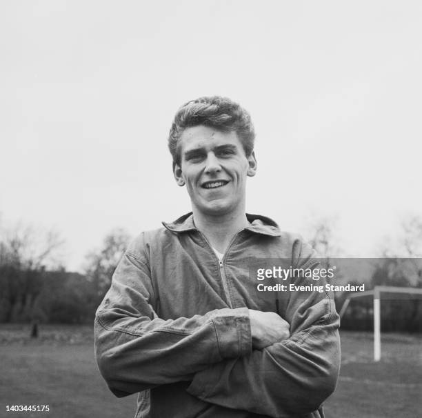 British footballer Bobby Thomson , his arms crossed, poses for a portrait during an England training session at Roehampton, London, England, 19th...