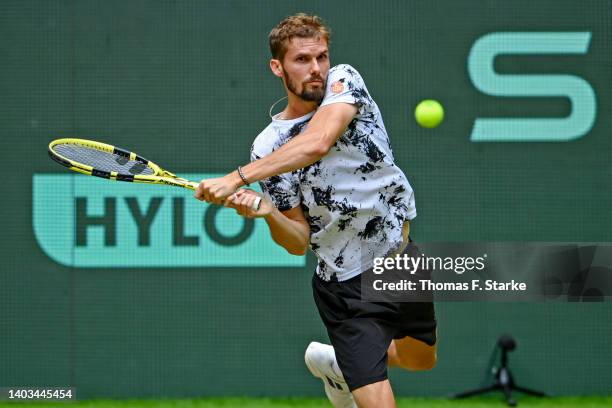 Oscar Otte of Germany plays a backhand in his match against Karen Khachanov of Russia during day seven of the 29th Terra Wortmann Open at OWL-Arena...