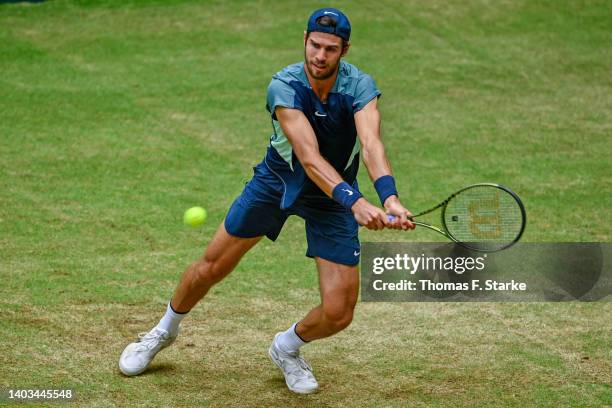 Karen Khachanov of Russia plays a backhand in his match against Oscar Otte of Germany during day seven of the 29th Terra Wortmann Open at OWL-Arena...