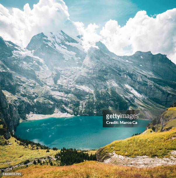 mountain landscape and the lake oeschinensee - switzerland stock pictures, royalty-free photos & images