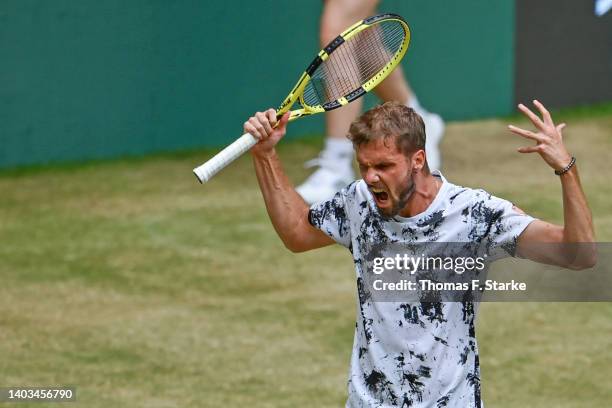 Oscar Otte of Germany celebrates in his match against Karen Khachanov of Russia during day seven of the 29th Terra Wortmann Open at OWL-Arena on June...