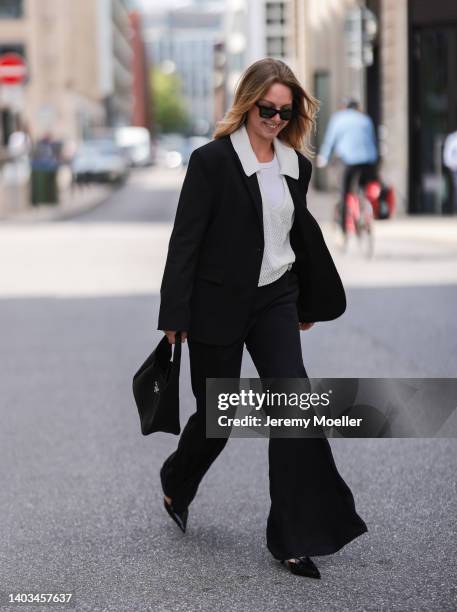 Liesa Späht seen wearing a black Celine sunglasses, a white top from SoSue, a creme crochet blouse from SoSue, a black SoSue oversized blazer, a...