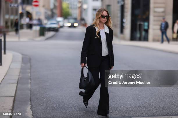 Liesa Späht seen wearing a black Celine sunglasses, a white top from SoSue, a creme crochet blouse from SoSue, a black SoSue oversized blazer, a...