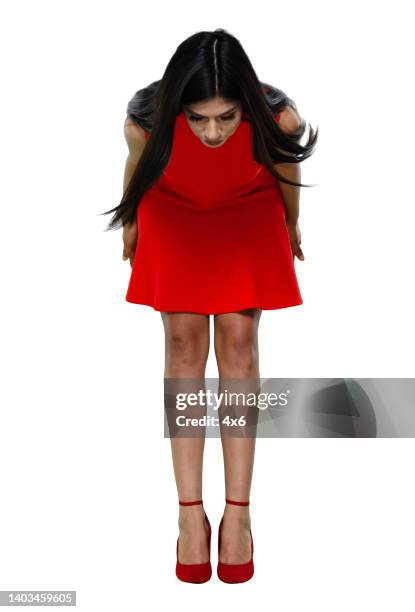 latin american and hispanic ethnicity young women bowing in front of white background wearing dress - bowing stock pictures, royalty-free photos & images