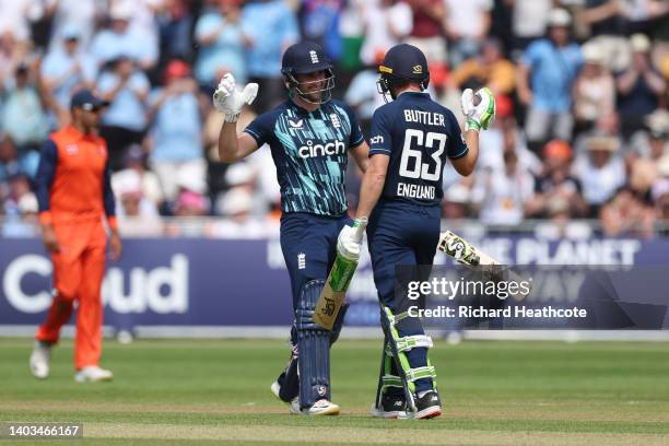 Liam Livingstone and Jos Buttler of England celebrate as they finish the innings and set a new World Record 50 over international score of 498-4...