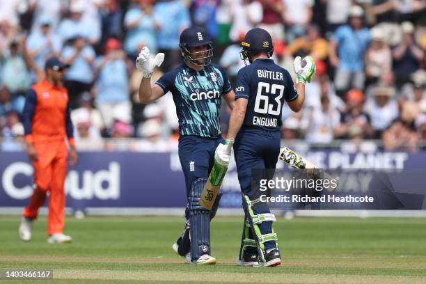 Liam Livingstone and Jos Buttler of England celebrate as they finish the innings and set a new World Record 50 over international score of 498-4...