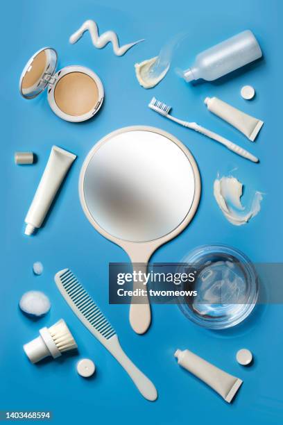 flat lay toiletries and facial product on blue background. - toiletries stock pictures, royalty-free photos & images