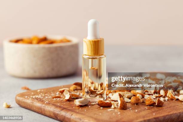 almond essential oil - almond oil stock pictures, royalty-free photos & images