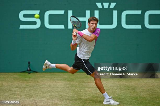 Pablo Carreno Busta of Spain plays a backhand in his match against Nick Kyrgios of Australia during day seven of the 29th Terra Wortmann Open at...