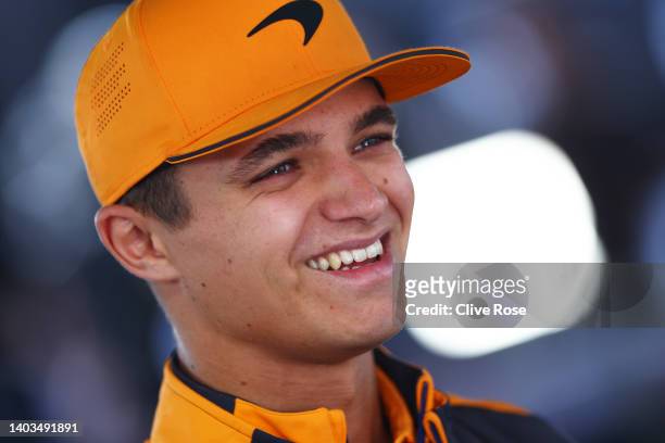 Lando Norris of Great Britain and McLaren talks to the media in the Paddock prior to practice ahead of the F1 Grand Prix of Canada at Circuit Gilles...
