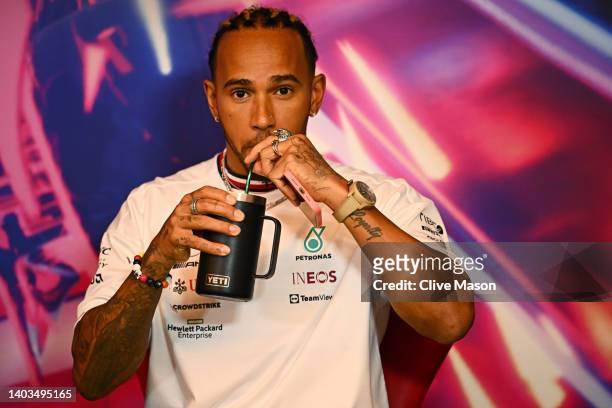 Lewis Hamilton of Great Britain and Mercedes takes a drink in the Drivers Press Conference prior to practice ahead of the F1 Grand Prix of Canada at...