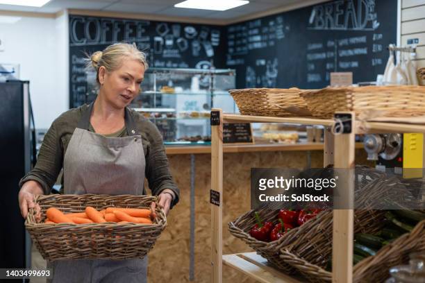 fresh vegetables stocked in store - food company manager stock pictures, royalty-free photos & images