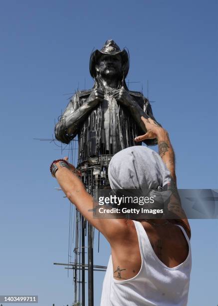Caroline Brisset, the artist who created the new metal statue of Motörhead singer Lemmy Kilmister poses on June 17, 2022 in Clisson, France. After a...