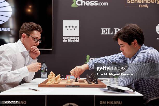 Fabiano Caruana of the United States and Hikaru Nakamura also of the United States react during their game on the first day of competition at the...