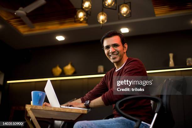 businessman using laptop at coffee shop - sitting chair office relax stock pictures, royalty-free photos & images