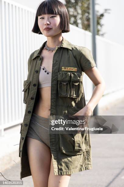 Guest is seen ahead of the Dsquared2 fashion show wearing culottes, crop top and fisherman shirt during the Milan Fashion Week S/S 2023 on June 17,...