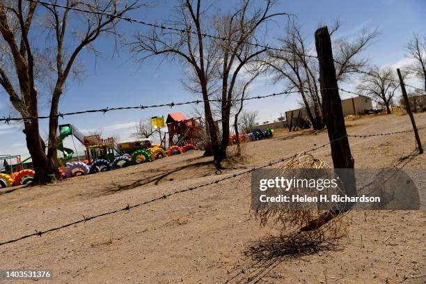 Tumbleweed is caught in a barbed wire fence surrounding the Church of the Living God on April 20, 2022 in Hooper, Colorado. The tiny town of Hooper,...