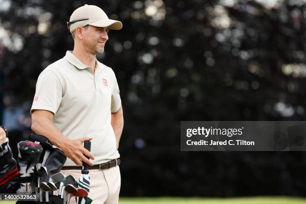 Adam Scott of Australia stands next to his golf bag on the 16th tee during the second round of the 122nd U.S. Open Championship at The Country Club...