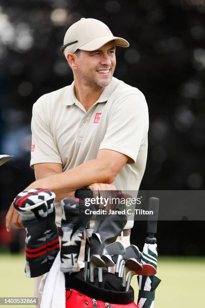 Adam Scott of Australia stands next to his golf bag on the 16th tee during the second round of the 122nd U.S. Open Championship at The Country Club...