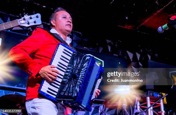 hispanic accordionist performing in a concert - accordionist stock pictures, royalty-free photos & images