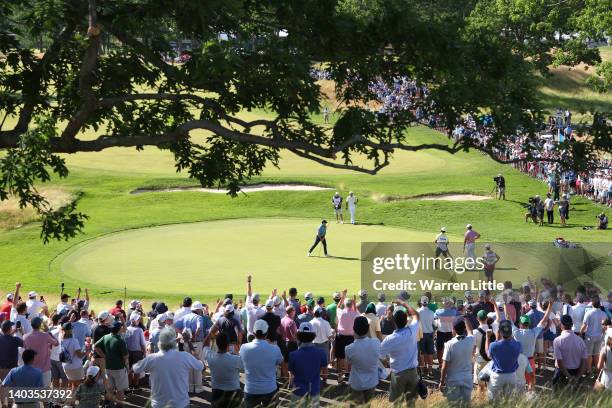 General view of the 12th hole is seen as Rory McIlroy of Northern Ireland makes a putt for birdie during the second round of the 122nd U.S. Open...