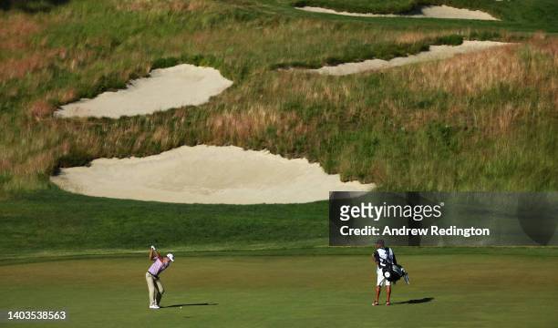 Davis Riley of the United States plays his third shot on the 14th hole during the second round of the 122nd U.S. Open Championship at The Country...