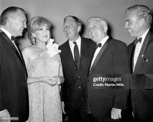American comedienne, actress, singer and businesswoman Edie Adams , American actor, dancer, singer, vaudevillian and stage performer Ray Bolger and...