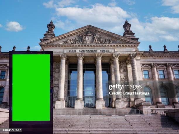 berlin reichstag building with green screen chroma key advertising billboards. large to medium size green screen chroma key marketing advertisement targeting adverts at consumers, retail shoppers, commuters and tourists. - berlin digital stock pictures, royalty-free photos & images