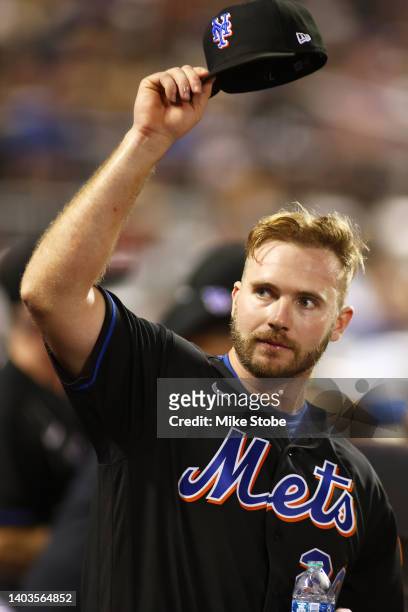 Pete Alonso of the New York Mets comes out for a curtain call after hitting a grand slam home run in the sixth inning against the Miami Marlins at...