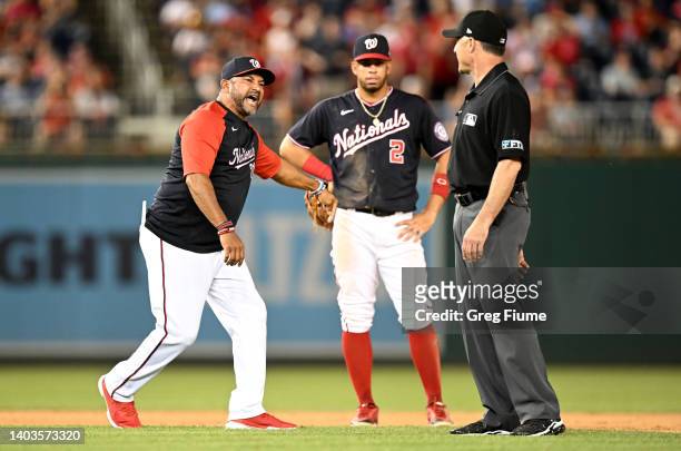 Manager Dave Martinez of the Washington Nationals argues with second base umpire Dan Iassogna after getting thrown out of the game in the tenth...
