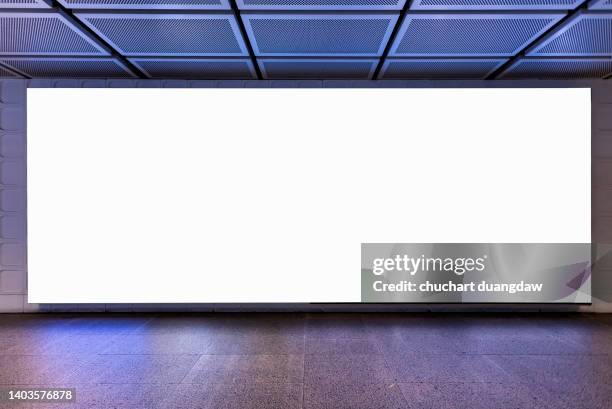 blank billboard advertising banner media display on a subway station wall - airport advertising stock pictures, royalty-free photos & images